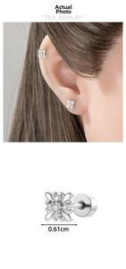Detail view of 0.61cm silver floral cross ear stud with zircons and screw back