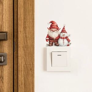 Christmas wall decal featuring a festive gnome and snowman above a light switch