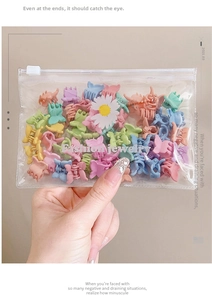 Mini butterfly hair clips in macaron colors packed in a zipper bag with daisy pattern