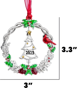 Detail of silver 2023 Christmas ornament with cardinal bird and size dimensions