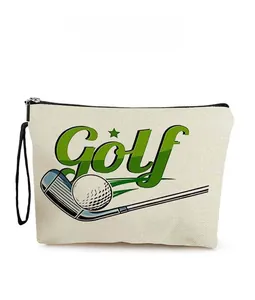 Detail of golf-themed canvas toiletry bag with club print and black wrist strap handle