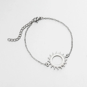 Detail of silver sun pendant bracelet featuring lobster clasp and adjustable extension chain