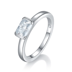 Close-up of radiant cut moissanite ring with high-polished silver finish and mirror reflection