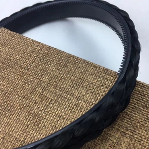Close-up of black braided hair headband with anti-slip inner teeth texture detail