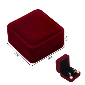 Detail of red velvet jewelry box showing closed dimensions and open interior for earrings