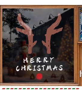 Detail of reindeer antler window stickers with white Merry Christmas text for festive decor