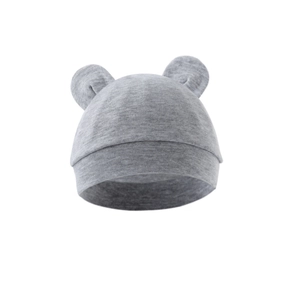 Gray knitted baby beanies with cute bear ears decoration on clean white background