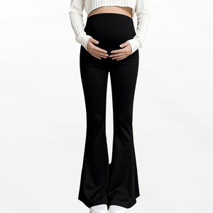 Detail of maternity leggings featuring a high-waist support band and flare leg design