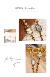 Detail of elegant gold mesh band watches with oval dials in white and navy blue finishes