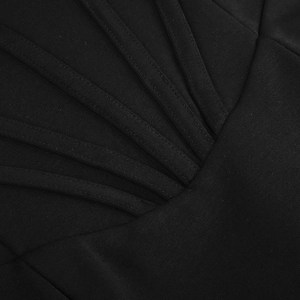 Macro shot of radial strap design and stitched twill texture on a black fishtail dress