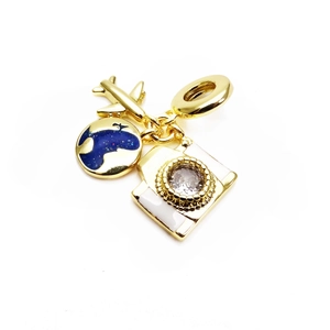 Detailed gold charms featuring airplane, globe, and gem-set camera for charm bracelets