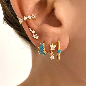 Gold plated S925 earrings set with turquoise and zircon stones in a layered ear stack view