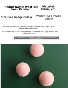 Detail showing three pink wool felt ball ornaments for Christmas tree decoration