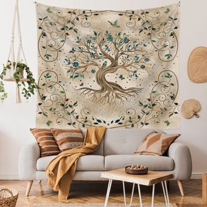 Detail of Tree of Life tapestry with blue flowers and birds over a cozy sofa decor