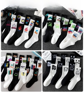 Detail view of cotton street style crew socks with graffiti and monster patterns, size 37-46