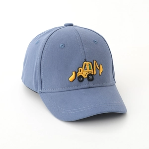Detailed embroidery of a yellow excavator on a blue cotton kids baseball hat fabric
