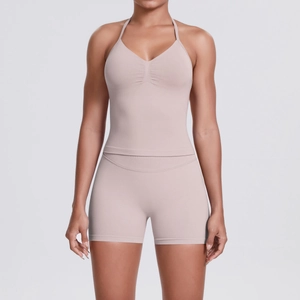 Detail of high-stretch seamless yoga set with halter neck top and high waist shorts