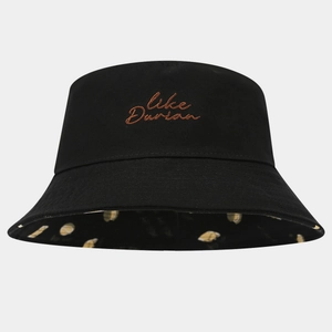 Detail of black cotton bucket hat featuring Like Durian embroidery and patterned lining