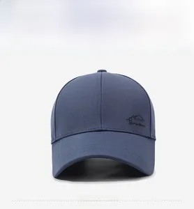 Detail of navy blue twill cotton baseball cap with mountain embroidery and curved brim