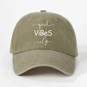 Detailed view of Good Vibes Only embroidery on washed cotton olive green baseball cap