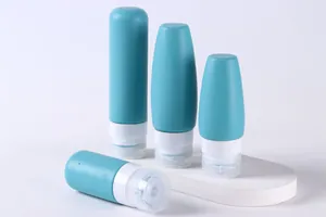 Detailed view of 100ml and 60ml soft matte silicone travel bottles with capacity labels