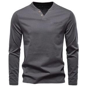 Detail of dark grey V-neck Henley shirt featuring brown buttons and a welt chest pocket
