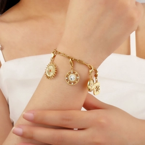 Gold stainless steel bracelet with sun and moon charms and colorful zircon gemstones