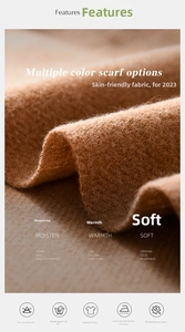 Detailed macro view of soft solid-colored scarf fabric texture and warm cashmere-like fringe