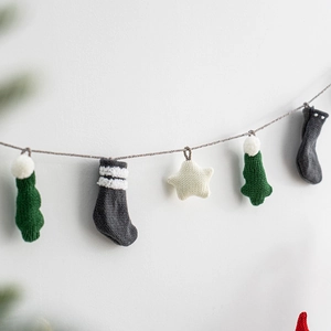 Handmade knitted Christmas bunting banner with trees, socks and stars decorations