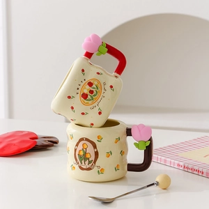 Modern ceramic tulip mug set with decorative pink flower handle and matching spoon