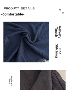 Close-up of navy and charcoal twill meditation shawl with soft fringe and fine stitching