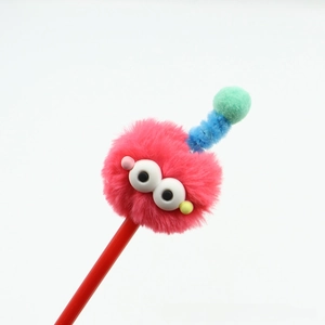 Macro detail of monster plush ball pen with magenta fur and blue spiral antennas