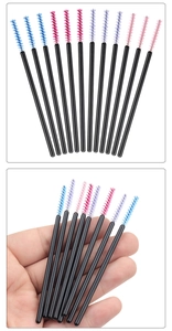 Macro view of colorful nylon eyelash brushes with black handles for professional makeup