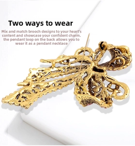 Detailed back view of vintage gold alloy brooch with pin and hidden pendant loop