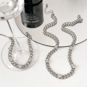 Silver chunky chain jewelry set featuring rhinestone heart pendants on necklace and bracelet