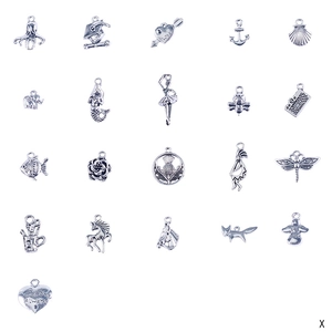 Detailed flat lay of 21 unique silver charms featuring ocean, animals, and heart shapes
