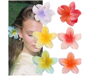 Detail view of tropical flower hair claw clips in various gradient colors and resin material