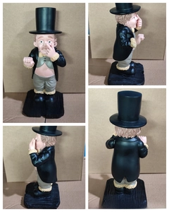Multiple views of a resin gentleman figurine in a black tuxedo and top hat with humorous face
