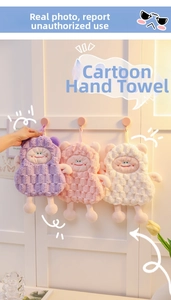Detail of cartoon monster hand towels in thick coral fleece with waffle texture