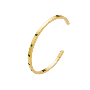 Detailed view of 18k gold plated C-shaped bangle with five emerald green zircon stones
