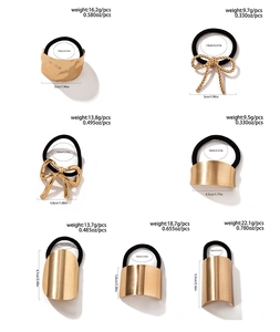 Detail view of seven golden alloy hair rings with weight and size specifications