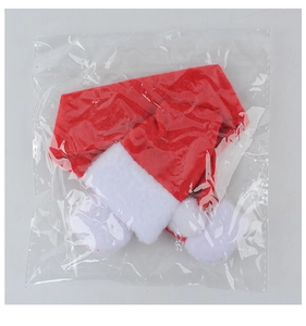 Close-up of mini red Christmas hats in plastic packaging for holiday decor or small gifts
