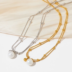 Double-layered stainless steel necklace with metallic beads and a large pearl pendant