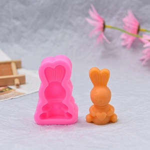 Detailed rabbit silicone mold showing intricate bunny holding heart texture and orange finish