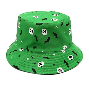Detail of Halloween bucket hat with pumpkin and bat prints on green twill fabric