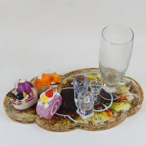 Cloud shaped resin tray with gold foil edges and colorful swirl texture for home decor