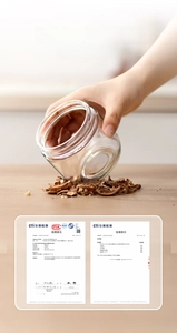 Detail view of a clear glass kitchen oil bottle and food storage jar, durable and practical.
