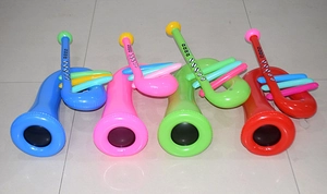 Detailed view of four colorful inflatable PVC saxophones in blue pink green and red