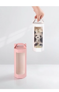 Detail of hexagonal gift boxes with PVC windows and handles in pink and white
