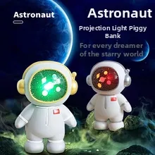 Astronaut piggy bank with LED projector function showing starry galaxy light effects